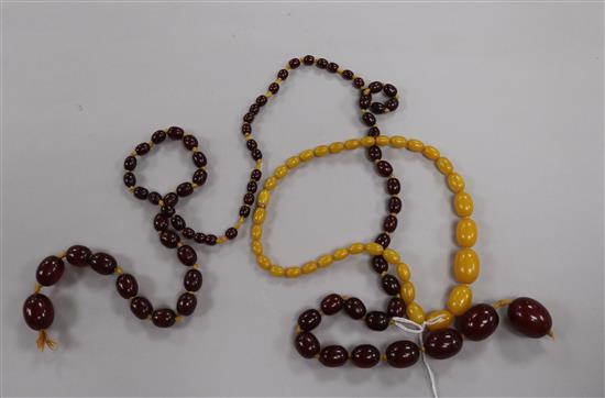 A graduated simulated cherry amber bead necklace, approx 76g and another amber style necklace.